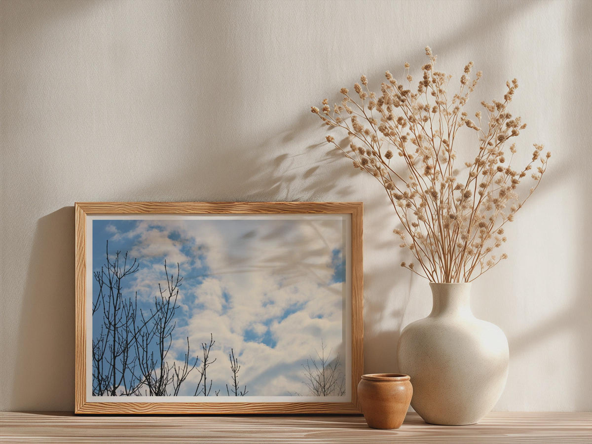 Bare Winter Trees Blue Sky Poster, Cloudy Sky Framed-Print, Minimalist Nature Wall Art, Black Branch Photography, Calm Living Room Decor