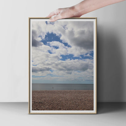 Pebble Beach Coastal Photography Print, Dramatic Sky Sea Poster, British Seaside Wall Art, Paddle Boarder Ocean Photo Print