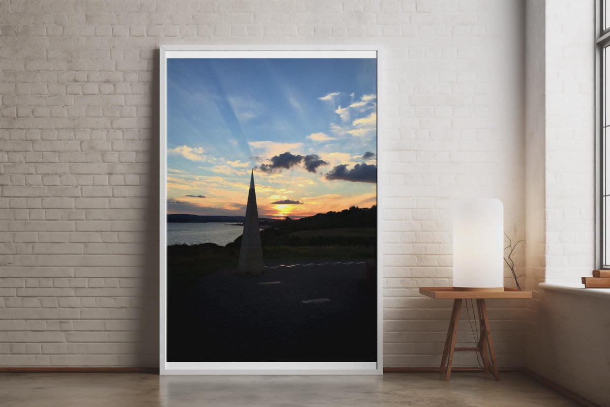 Coastal Sunset Obelisk Poster, Dramatic Sky Wall Art, Seaside Landmark Print, Golden Hour Coastal Photography, Dusk Seascape Wall Decor