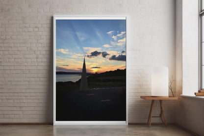 Coastal Sunset Obelisk Poster, Dramatic Sky Wall Art, Seaside Landmark Print, Golden Hour Coastal Photography, Dusk Seascape Wall Decor
