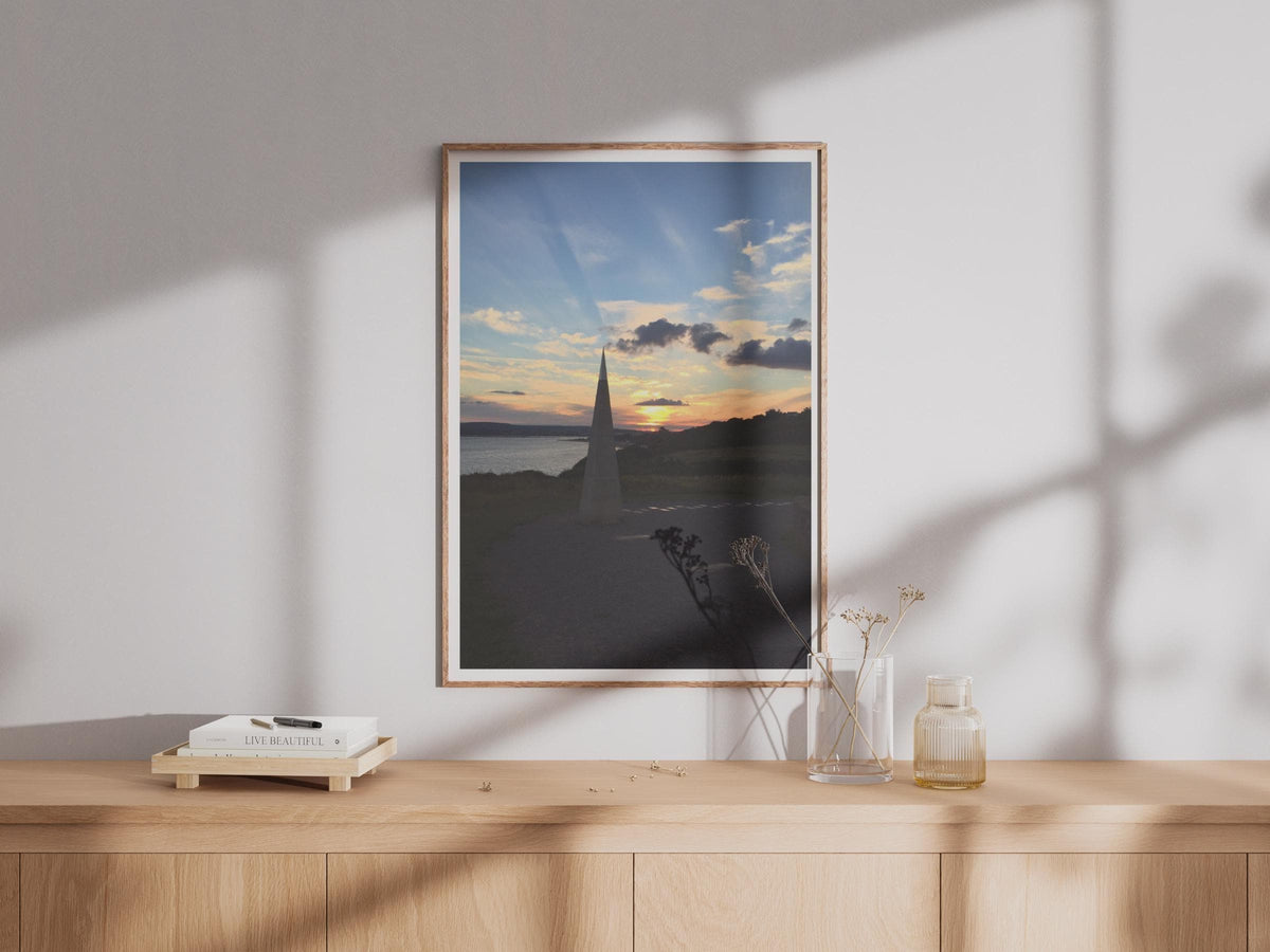 Coastal Sunset Obelisk Poster, Dramatic Sky Wall Art, Seaside Landmark Print, Golden Hour Coastal Photography, Dusk Seascape Wall Decor