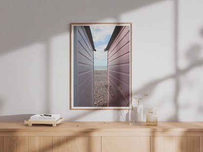 Beach Hut Photography Print, Pebble Beach Coastal Poster, British Seaside Wall Art, Pink Pastel Huts, UK Coast Photo Print