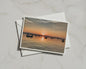 Sunset Harbour A6 Card, Coastal Boats at Dusk, Orange Sky Seascape Greeting Card