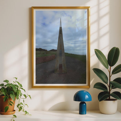 Coastal Obelisk Monument Poster, Stone Spire Landmark Wall Art Print, Dramatic Sky Sculpture Photography, Moody Coastal Landscape Print