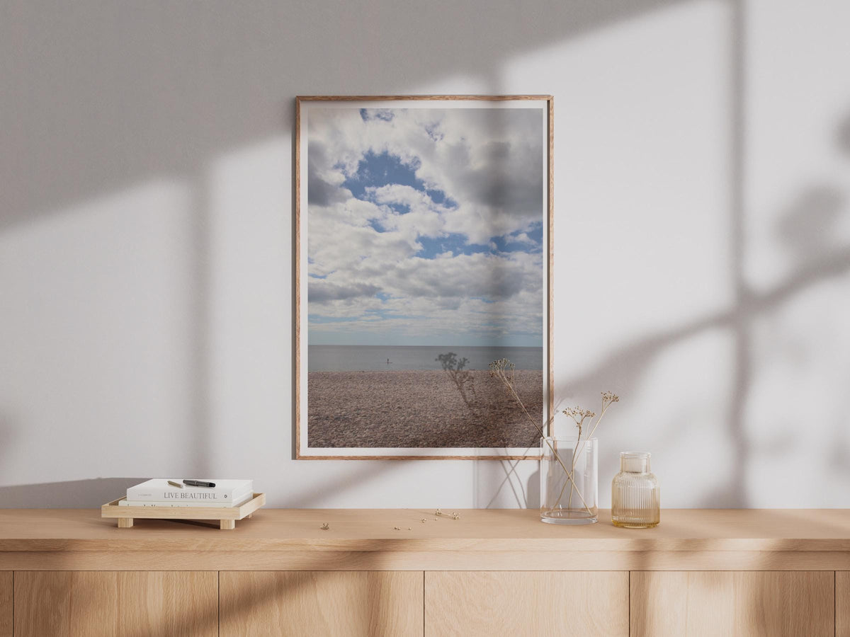 Pebble Beach Coastal Photography Print, Dramatic Sky Sea Poster, British Seaside Wall Art, Paddle Boarder Ocean Photo Print