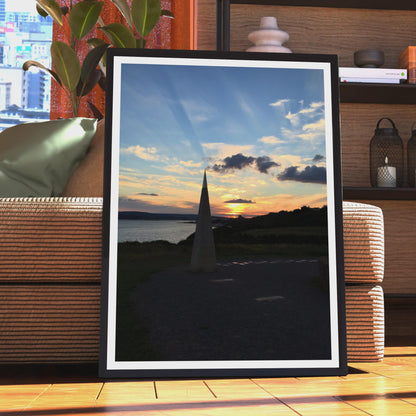 Coastal Sunset Obelisk Poster, Dramatic Sky Wall Art, Seaside Landmark Print, Golden Hour Coastal Photography, Dusk Seascape Wall Decor